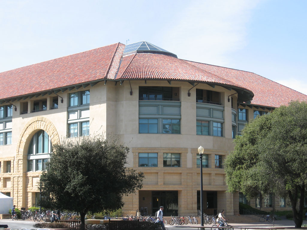 Stanford University's Gates Computer Science Building — home to the Stanford Digital Economy Lab, whose payroll-data study underlies this section