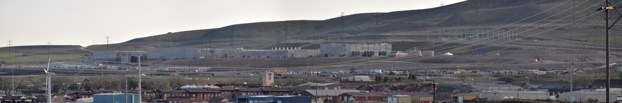 A large data centre building complex on a hillside — an example of the physical scale of a mega data centre facility