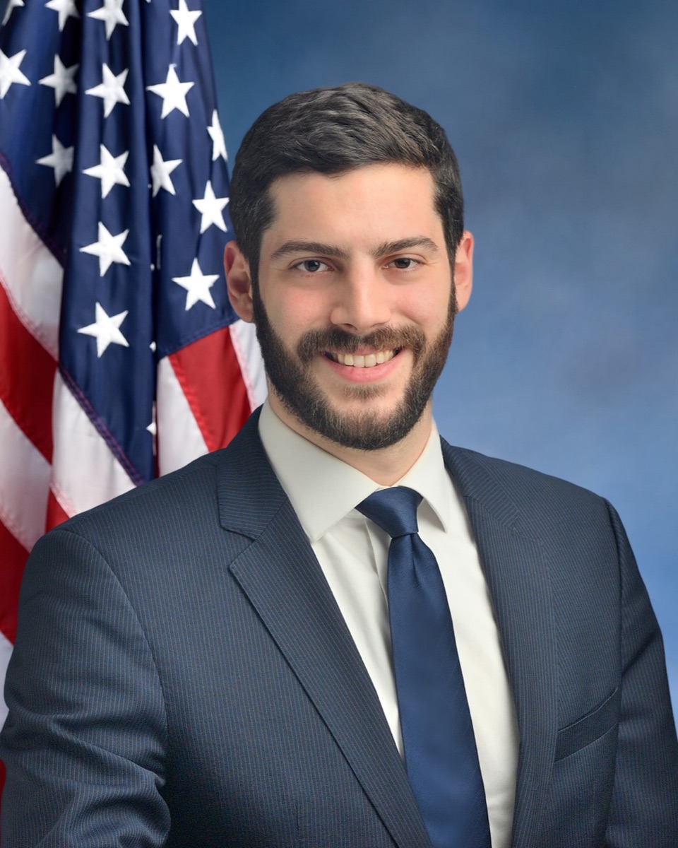 Official portrait of New York Assemblymember Alex Bores, sponsor of the AI dividend proposal
