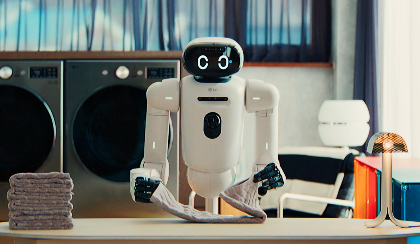 LG Electronics' humanoid robot CLOiD folding laundry in a space modeled on a home