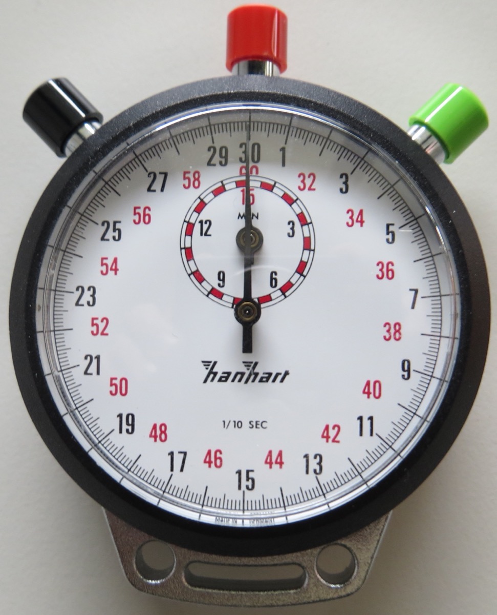 An analog stopwatch measuring to a tenth of a second — agent decision frequency and data freshness (Age of Information)