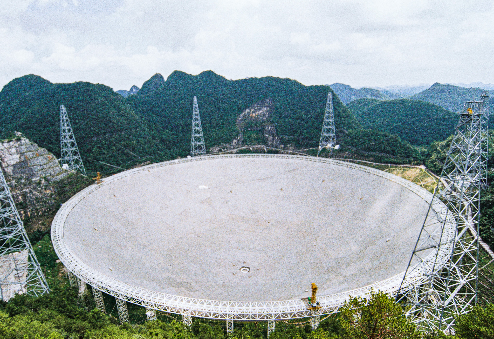 FAST radio telescope set into a karst mountain valley in Guizhou, China — a 500-meter spherical dish