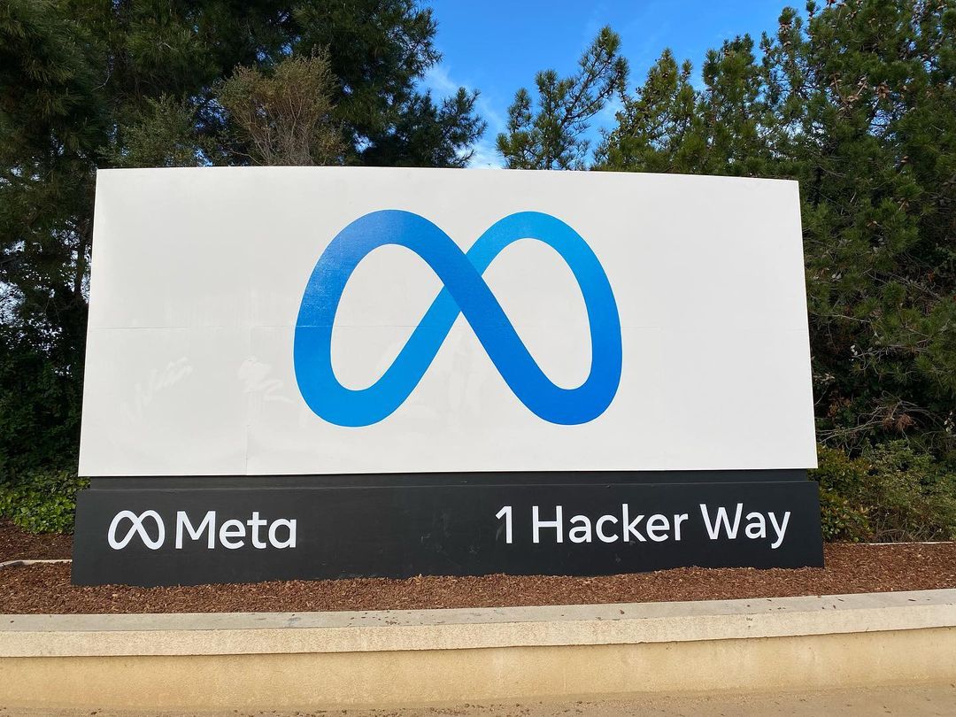 Meta's '1 Hacker Way' headquarters sign with the company logo