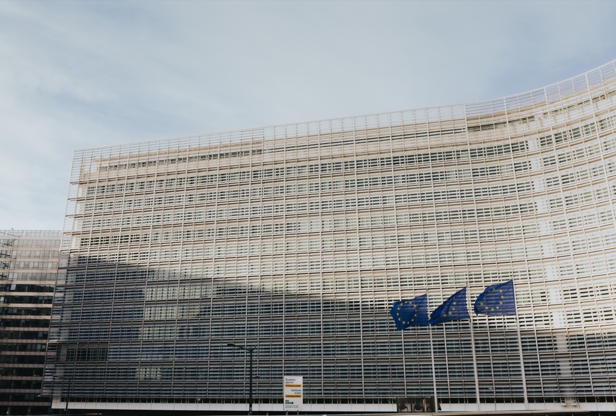 The Berlaymont building in Brussels, headquarters of the European Commission, with EU flags