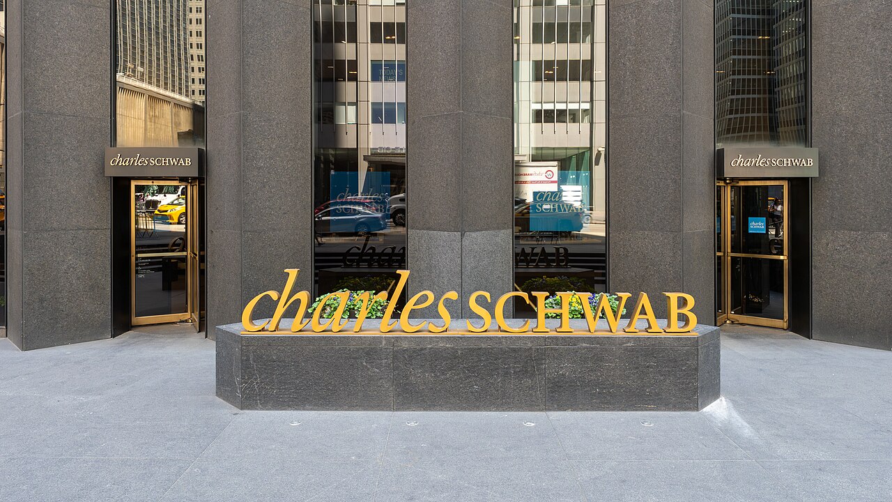 Charles Schwab logo signage at the entrance of its Manhattan office