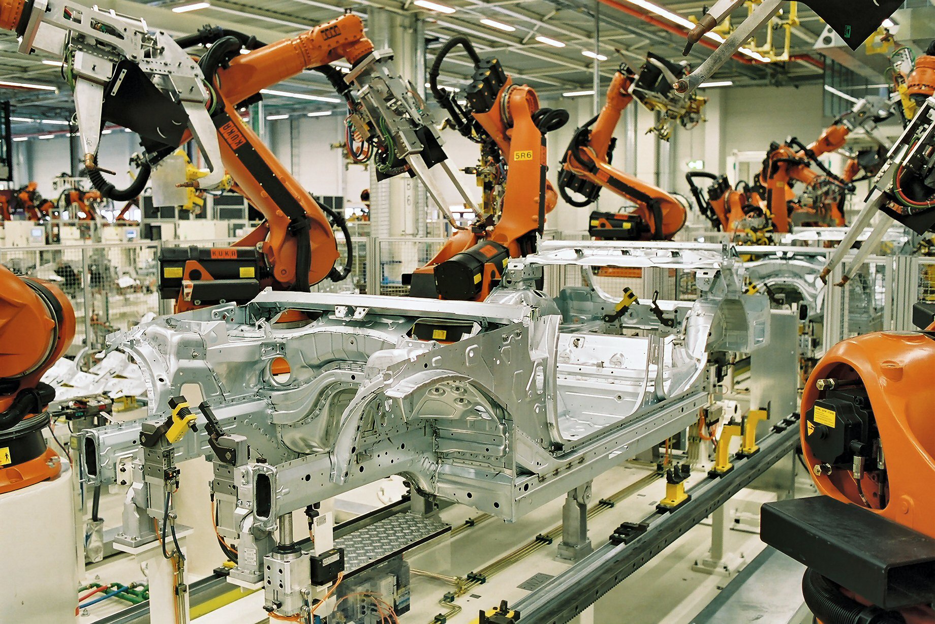 Industrial robot arm in BMW Leipzig factory body manufacturing (Karosseriebau) — modern automotive production automation