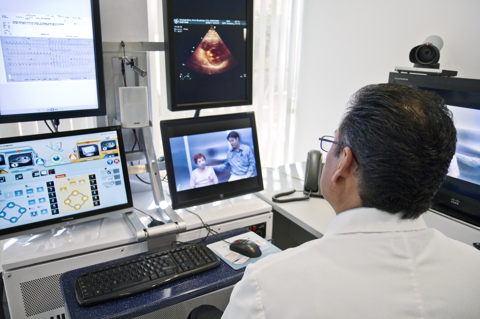 A clinician reviewing multi-screen patient data — deskilling and over-reliance on AI in healthcare